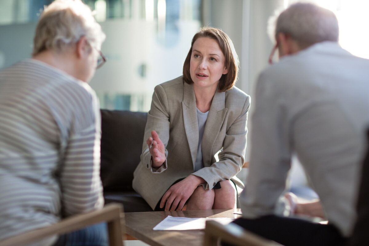 Middle aged woman meeting with client on a lobby